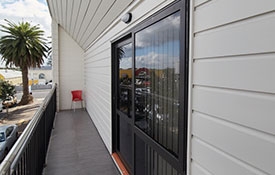 sliding doors open onto a balcony